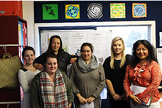 Mena Antonio with young women at workshop